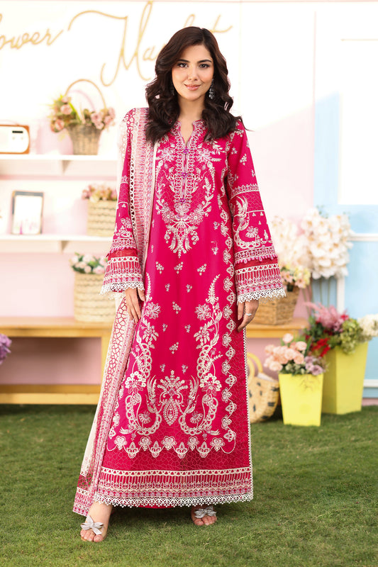 A woman wearing a hot pink lawn suit with embroidered details and a chiffon dupatta.