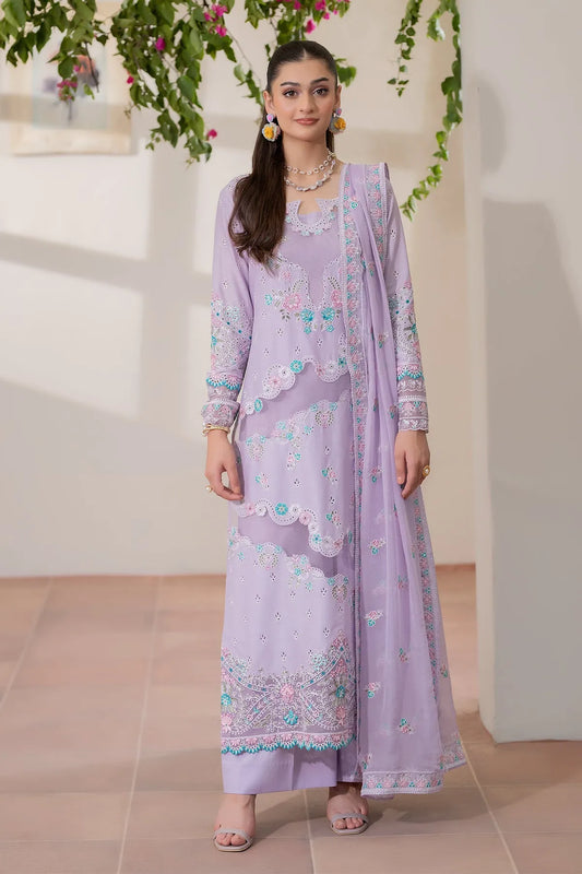 Woman wearing a light purple embroidered outfit with a matching dupatta in an indoor setting.